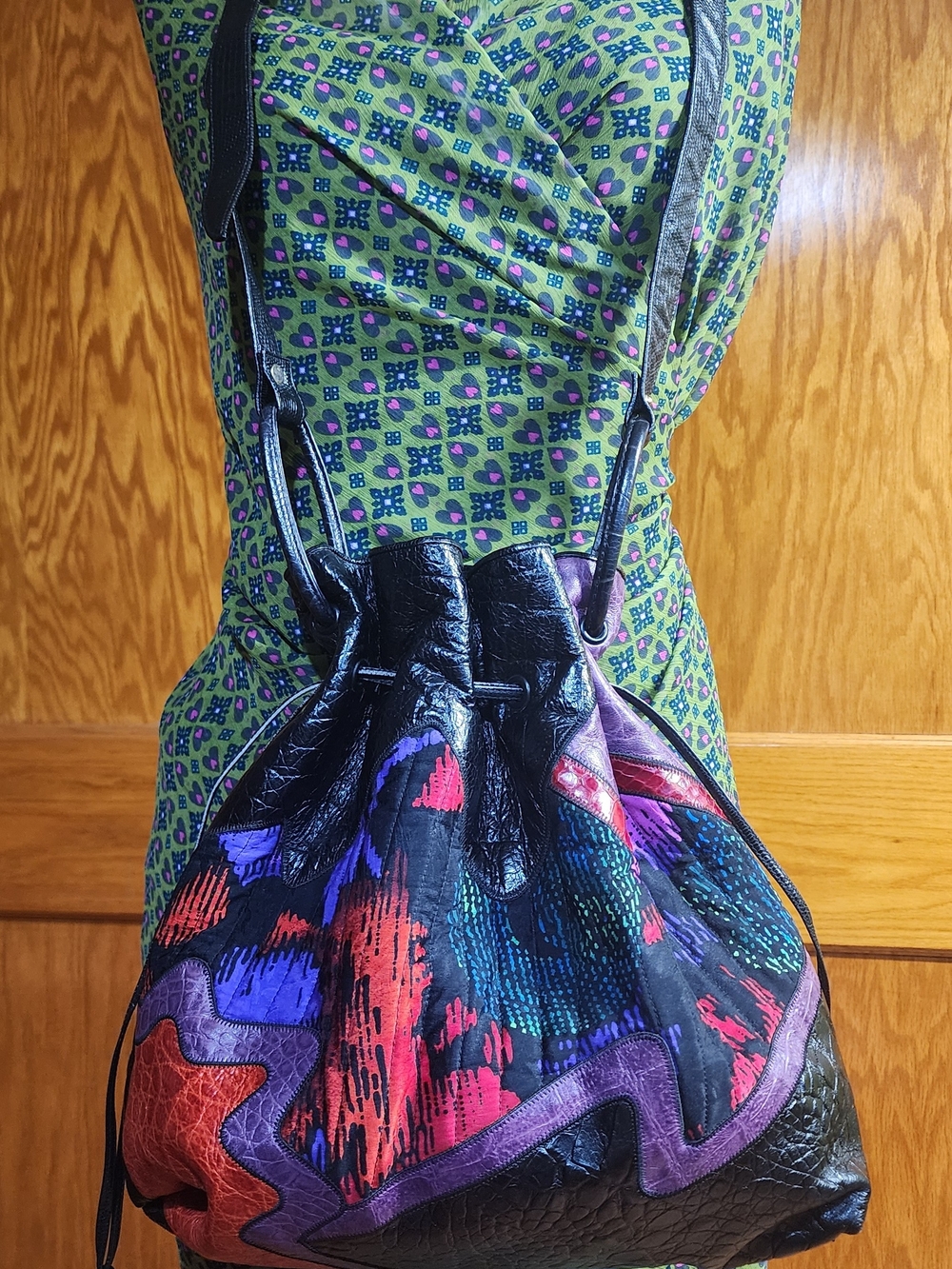 Sharif Black Leather Drawstring Shoulder Bag with Vibrant Accent Colors